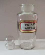 Load image into Gallery viewer, Antique Chemist Bottle with Ball Stopper and Foil Glass Covered Label
