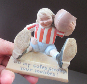 Antique Porcelain Match Holder & Striker by Schafer & Vater. FOOTBALLER HOLDING A FOOTBALL