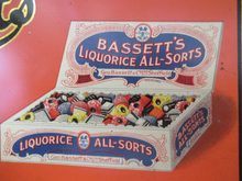 Load image into Gallery viewer, Vintage 1930s Art Deco Bassett&#39;s Liquorice All-sorts in Orange Tin
