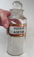 Load image into Gallery viewer, Antique Chemist Bottle with Ball Stopper and Foil Glass Covered Label
