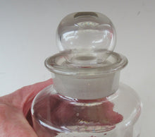 Load image into Gallery viewer, Antique Chemist Bottle with Ball Stopper and Foil Glass Covered Label
