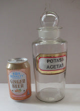 Load image into Gallery viewer, Antique Chemist Bottle with Ball Stopper and Foil Glass Covered Label
