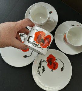 Pair of Susie Cooper Cornpoppy Trios