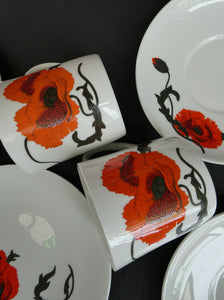 Pair of Susie Cooper Cornpoppy Trios