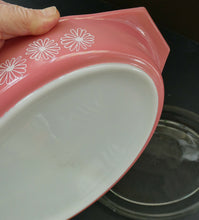 Load image into Gallery viewer, Two 1950s Vintage PYREX GAEITY Serving Dishes. One Oval Pink with Daisy Pattern. One Oblong Black Dish with Snowflake Pattern
