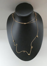 Load image into Gallery viewer, Long Fancy Guard or Muff Chain with Gold Ball Inclusions. 14 Carat Gold. Weight 11 grams
