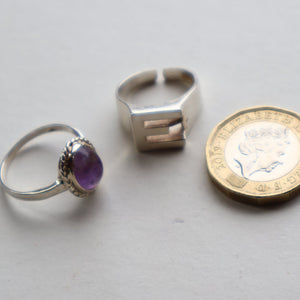 TWO Vintage Child's Size Silver Rings; One with the Initial "E" and the other (smaller) with an Amethyst.