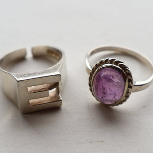 TWO Vintage Child's Size Silver Rings; One with the Initial "E" and the other (smaller) with an Amethyst.