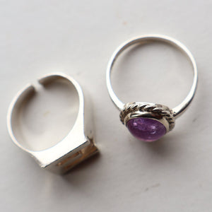 TWO Vintage Child's Size Silver Rings; One with the Initial "E" and the other (smaller) with an Amethyst.