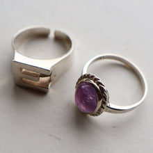 Load image into Gallery viewer, TWO Vintage Child&#39;s Size Silver Rings; One with the Initial &quot;E&quot; and the other (smaller) with an Amethyst.
