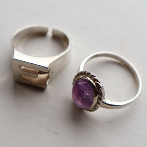 TWO Vintage Child's Size Silver Rings; One with the Initial "E" and the other (smaller) with an Amethyst.