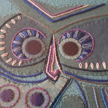 Load image into Gallery viewer, LARGE Kitsch Embroidery Turquoise Tweed Collage Panel Showing a Large Stylized Owl. In original 60s frame

