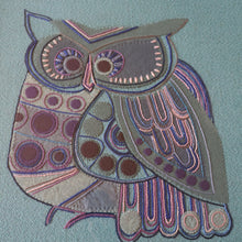 Load image into Gallery viewer, LARGE Kitsch Embroidery Turquoise Tweed Collage Panel Showing a Large Stylized Owl. In original 60s frame
