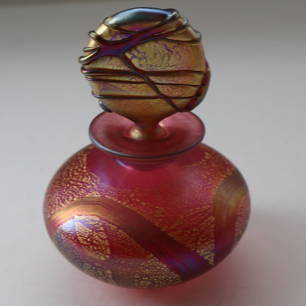 Early Vintage ISLE OF WIGHT Perfume Bottle (Golden Peacock in Pink) with Lollipop Stopper. 4 1/4 inches 