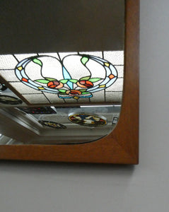 1960s DANISH Pedersen & Hansen (P&H) wall mirror in a teak wooden frame with a small integrated shelf