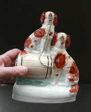 Load image into Gallery viewer, Antique Staffordshire King Charles Spaniel Dogs Sitting on Top of a Barrel. Genuine Victorian Figurine
