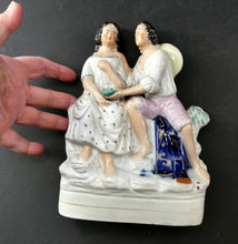 Load image into Gallery viewer, Antique 19th Century Staffordshire Figurine. Couple with a Nest 
