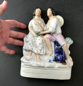 Antique 19th Century Staffordshire Figurine. Couple with a Nest 