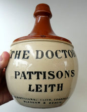 Load image into Gallery viewer, Rare BUCHAN Stoneware Whisky Jug. &quot;THE DOCTOR&quot; Pattisons, Leith
