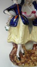 Load image into Gallery viewer, Antique Staffordshire Figurine. Pair of Scottish Lasses Dancing. Antique Ceramic Pocket Watch Holder
