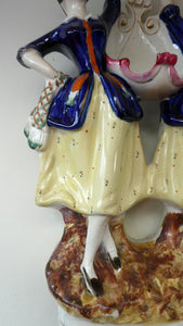 Antique Staffordshire Figurine. Pair of Scottish Lasses Dancing. Antique Ceramic Pocket Watch Holder