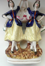 Load image into Gallery viewer, Antique Staffordshire Figurine. Pair of Scottish Lasses Dancing. Antique Ceramic Pocket Watch Holder
