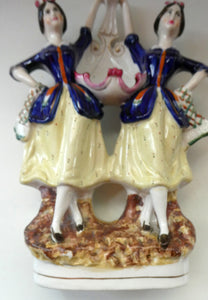 Antique Staffordshire Figurine. Pair of Scottish Lasses Dancing. Antique Ceramic Pocket Watch Holder
