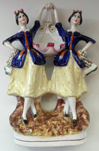 Load image into Gallery viewer, Antique Staffordshire Figurine. Pair of Scottish Lasses Dancing. Antique Ceramic Pocket Watch Holder
