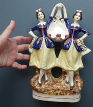 Load image into Gallery viewer, Antique Staffordshire Figurine. Pair of Scottish Lasses Dancing. Antique Ceramic Pocket Watch Holder
