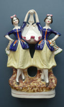 Load image into Gallery viewer, Antique Staffordshire Figurine. Pair of Scottish Lasses Dancing. Antique Ceramic Pocket Watch Holder

