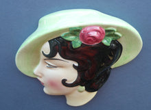 Load image into Gallery viewer, 1930s ART DECO Wall Mask by Cope &amp; Co. Art Deco Lady with Green Bonnet with Pink Flower. Black Hair
