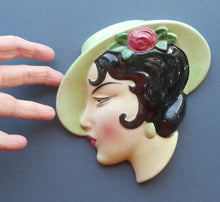 Load image into Gallery viewer, 1930s ART DECO Wall Mask by Cope &amp; Co. Art Deco Lady with Green Bonnet with Pink Flower. Black Hair
