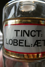 Load image into Gallery viewer, Larger Antique Clear Glass Chemist Bottle. TINCT: LOBEL: AETH with Original Foil Label and Lozenge Stopper
