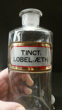 Load image into Gallery viewer, Larger Antique Clear Glass Chemist Bottle. TINCT: LOBEL: AETH with Original Foil Label and Lozenge Stopper
