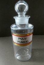 Load image into Gallery viewer, Large Antique Clear Glass Chemist Bottle. PULV: PUMICE: with Original Foil Label and Ball Stopper
