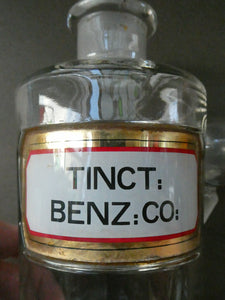 Large Antique Clear Glass Chemist Bottle. TINCT: BENZ: CO: with Original Foil Label and Ball Stopper