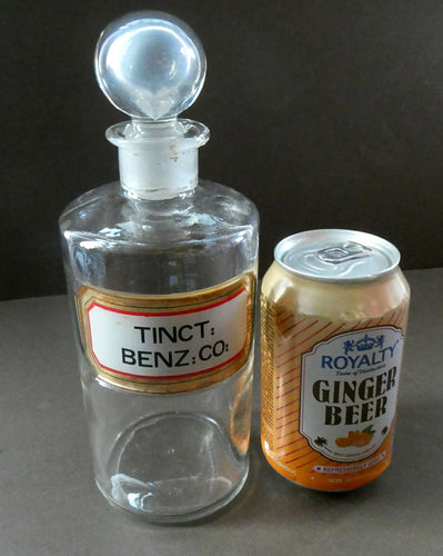 Large Antique Clear Glass Chemist Bottle. TINCT: BENZ: CO: with Original Foil Label and Ball Stopper