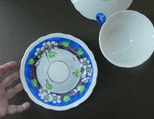 Load image into Gallery viewer, Vintage 1920s Hand Painted MAK MERRY Trio: Cup, Saucer and Side Plate. White Prunus on Blue
