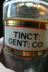 Larger Antique Clear Glass Chemist Bottle. TINCT: CENT: CO: with Original Foil Label and Lozenge Stopper