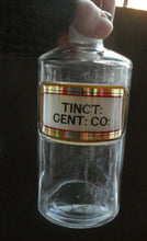 Load image into Gallery viewer, Larger Antique Clear Glass Chemist Bottle. TINCT: CENT: CO: with Original Foil Label and Lozenge Stopper
