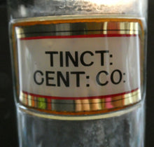 Load image into Gallery viewer, Larger Antique Clear Glass Chemist Bottle. TINCT: CENT: CO: with Original Foil Label and Lozenge Stopper
