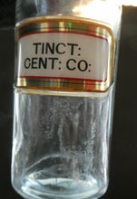 Load image into Gallery viewer, Larger Antique Clear Glass Chemist Bottle. TINCT: CENT: CO: with Original Foil Label and Lozenge Stopper
