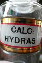 Load image into Gallery viewer, Antique Clear Glass Chemist Bottle. CALC: HYDRAS with Original Foil Label and Lozenge Stopper
