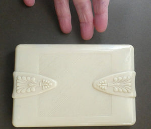 1930s Art Deco Cream Celluloid Trinket Box with Faux Decorative Clasps and a Hinged Lid