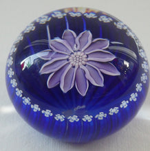 Load image into Gallery viewer, Scottish Paperweight by Peter McDougall Glass Studio. With Studio Cane on the Base with lilac lampwork flower 
