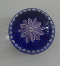 Load image into Gallery viewer, Scottish Paperweight by Peter McDougall Glass Studio. With Studio Cane on the Base with lilac lampwork flower 
