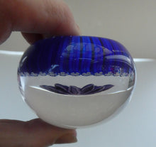 Load image into Gallery viewer, Scottish Paperweight by Peter McDougall Glass Studio. With Studio Cane on the Base with lilac lampwork flower 
