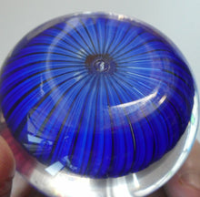 Load image into Gallery viewer, Scottish Paperweight by Peter McDougall Glass Studio. With Studio Cane on the Base with lilac lampwork flower 
