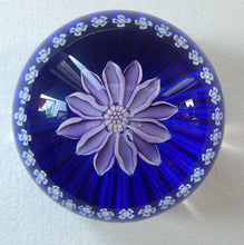 Load image into Gallery viewer, Scottish Paperweight by Peter McDougall Glass Studio. With Studio Cane on the Base with lilac lampwork flower 
