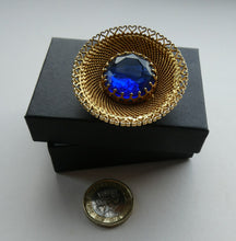 Load image into Gallery viewer, Vintage Costume Brooch with Heart Shapes on Rim and Blue Faceted Glass Insert
